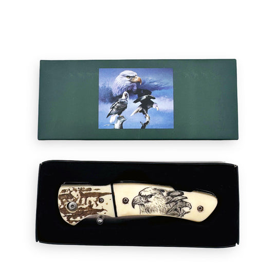 Rex Distributor KN 1859-E 4.25-inch eagle folding knife with belt clip, displayed in a set, showcasing its detailed wildlife design.