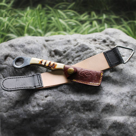 Bone Collector BC 866-BN 8-inch bone handle razor knife with leather sheath and sharpening strop belt for outdoor use.