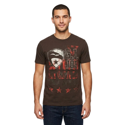 A man wearing a dark brown graphic t-shirt with a distressed red, white, and black design on the front, paired with dark blue jeans, photographed against a solid white background.