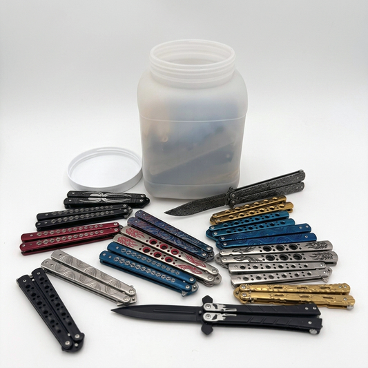 Set of 36 mixed butterfly trainer knives in a display jar, Rex Distributor, Inc. closeout deal, showcasing colorful trainer blades and handles.