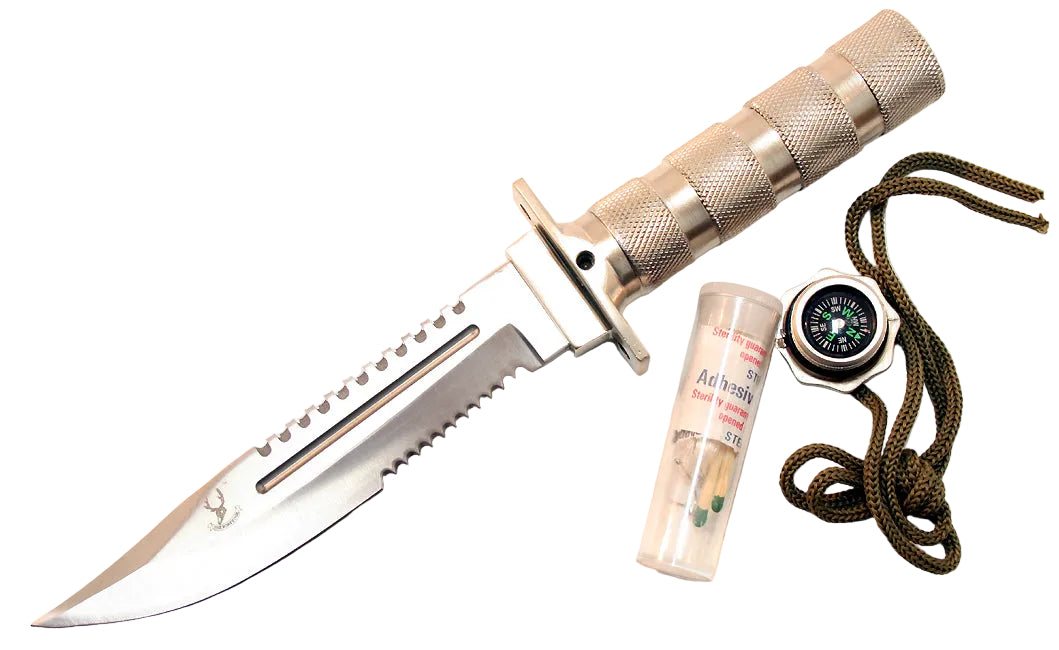 A tactical fixed-blade knife with a silver metallic blade and textured silver handle, shown alongside a small clear tube of sharpening steel, a compass, and a coiled green cord on a plain white background.
