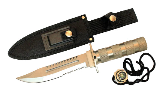 A tactical fixed-blade knife with a silver blade, textured tan handle, black nylon sheath, compass, and sharpening stone, displayed on a clean white background.