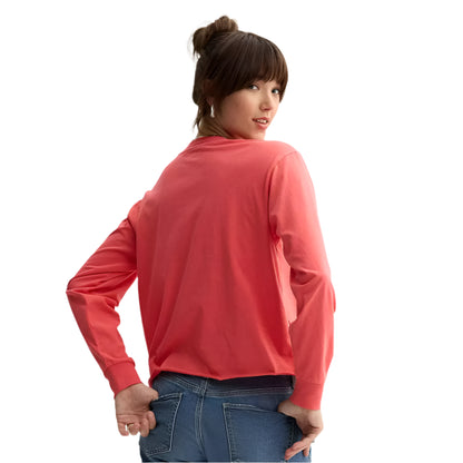 Person wearing a red long-sleeve shirt and blue jeans on a light gray background