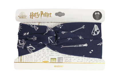 Navy blue headband with white patterns on a Harry Potter branded packaging
