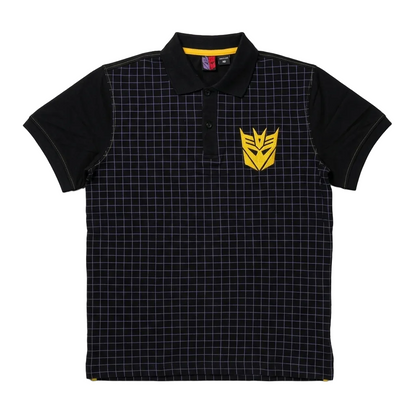 A black short-sleeve polo shirt with a subtle grid pattern, featuring a yellow Transformers Decepticon logo on the left chest and a yellow inner collar lining, displayed flat against a light gray background.