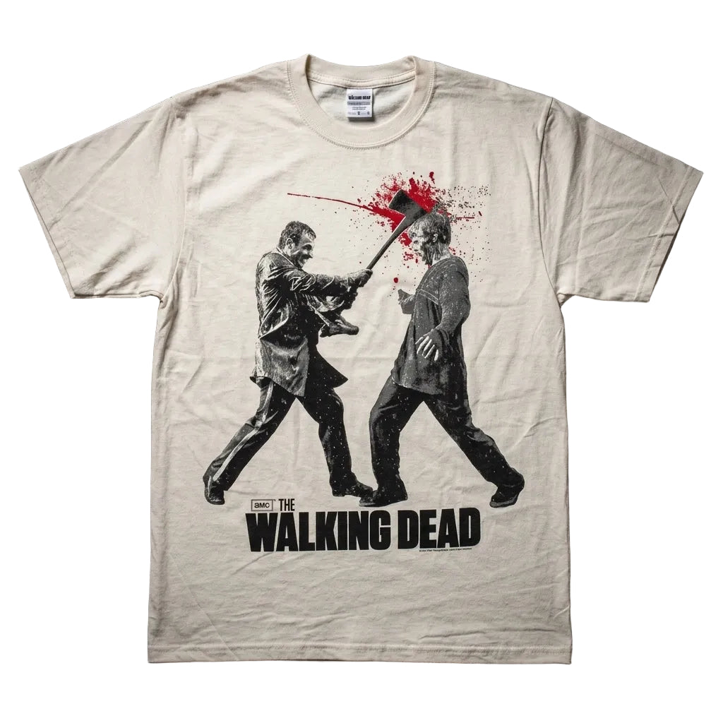 A cream-colored graphic t-shirt featuring a black and red print of Michael Myers and Laurie Strode from 'The Walking Dead' with the text 'WALKING DEAD' printed below, laid flat on a dark textured background.
