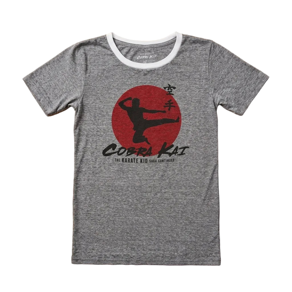 Gray t-shirt with Cobra Kai logo on a wooden surface