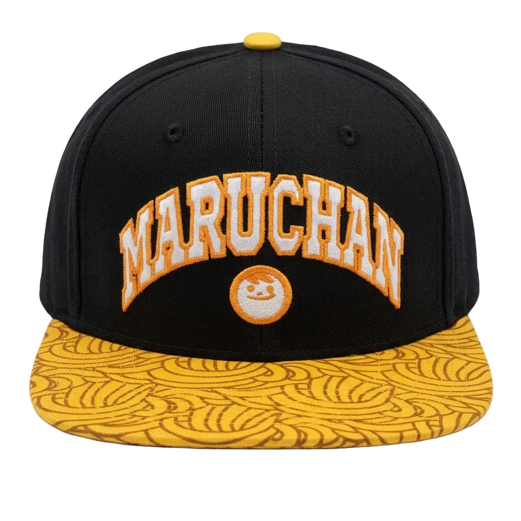 A black snapback cap with a yellow brim featuring a repeating wave pattern. The front has an arched 'MARUCHAN' logo in white with a yellow outline, and a small circular logo below it.