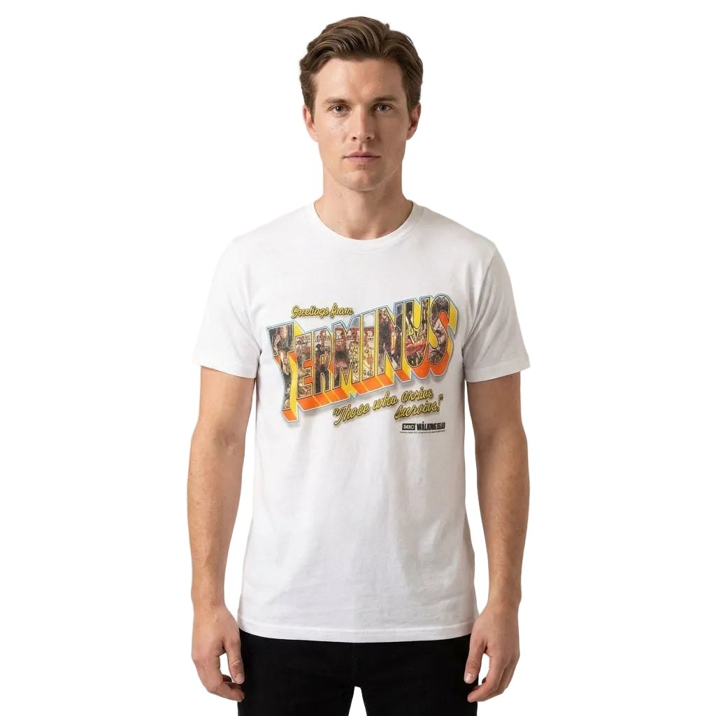 A man wearing a white crewneck t-shirt with a colorful graphic print on the front that reads 'Yerkaingo' and 'More than Scenery, More than'. The background is a clean, neutral off-white studio backdrop.