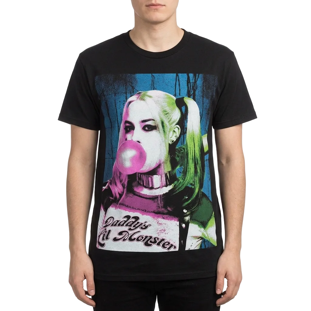 A man wearing a black graphic t-shirt featuring a stylized pop-art portrait of Harley Quinn blowing a pink bubblegum bubble, with the text 'Godd's Kill Monster' printed below.
