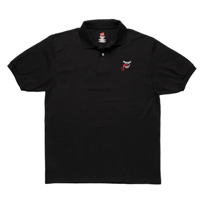 A black short-sleeve polo shirt laid flat on a light gray textured background, featuring a small embroidered red and white shark face logo on the left chest.