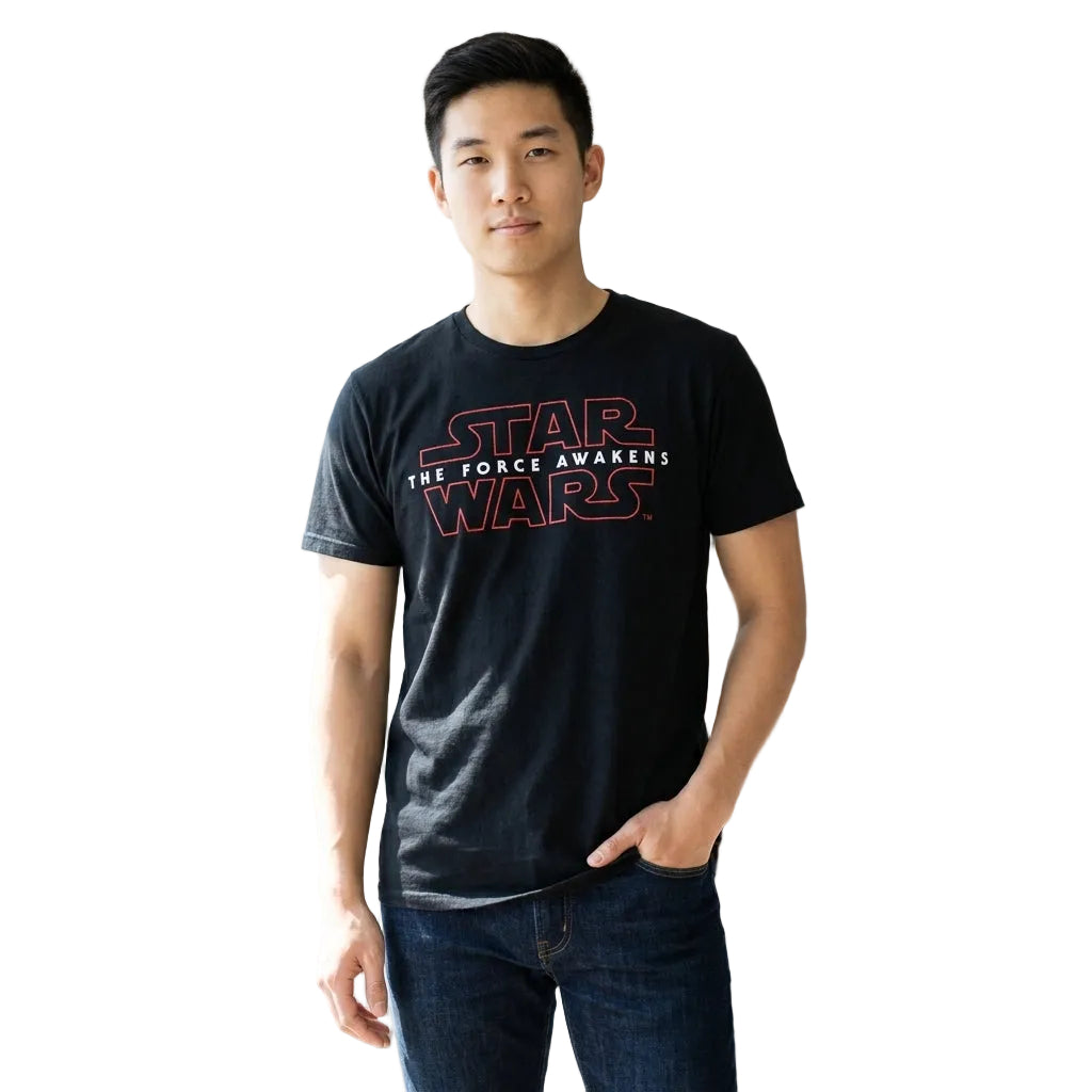 Person wearing a 'Star Wars' t-shirt in a room with a bookshelf.