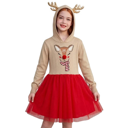 A young girl wearing a Christmas-themed hooded dress with a beige top featuring a reindeer face graphic, a red tulle skirt, and gold antlers on the hood, set against a plain white background.