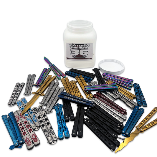 Set of 36 mixed butterfly trainers display knives from Rex Distributor, Inc., arranged in a clear jar for training purposes.