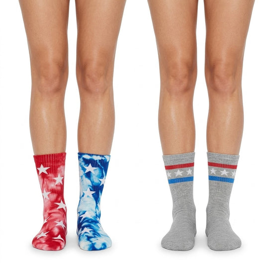 Pair of women's USA crew socks with tie dye and star patterns by Bioworld, size 4-10, displayed flat on a neutral background.