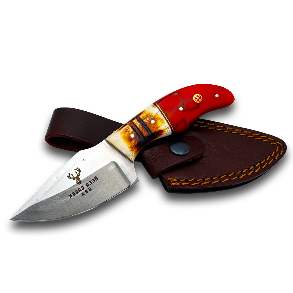 DC 002 7" Deer Creek Red Resin & Bovine Short Skinner Hunting Knife with Leather Sheath - Rex Distributor, Inc. Wholesale Licensed Products and T-shirts, Sporting goods,