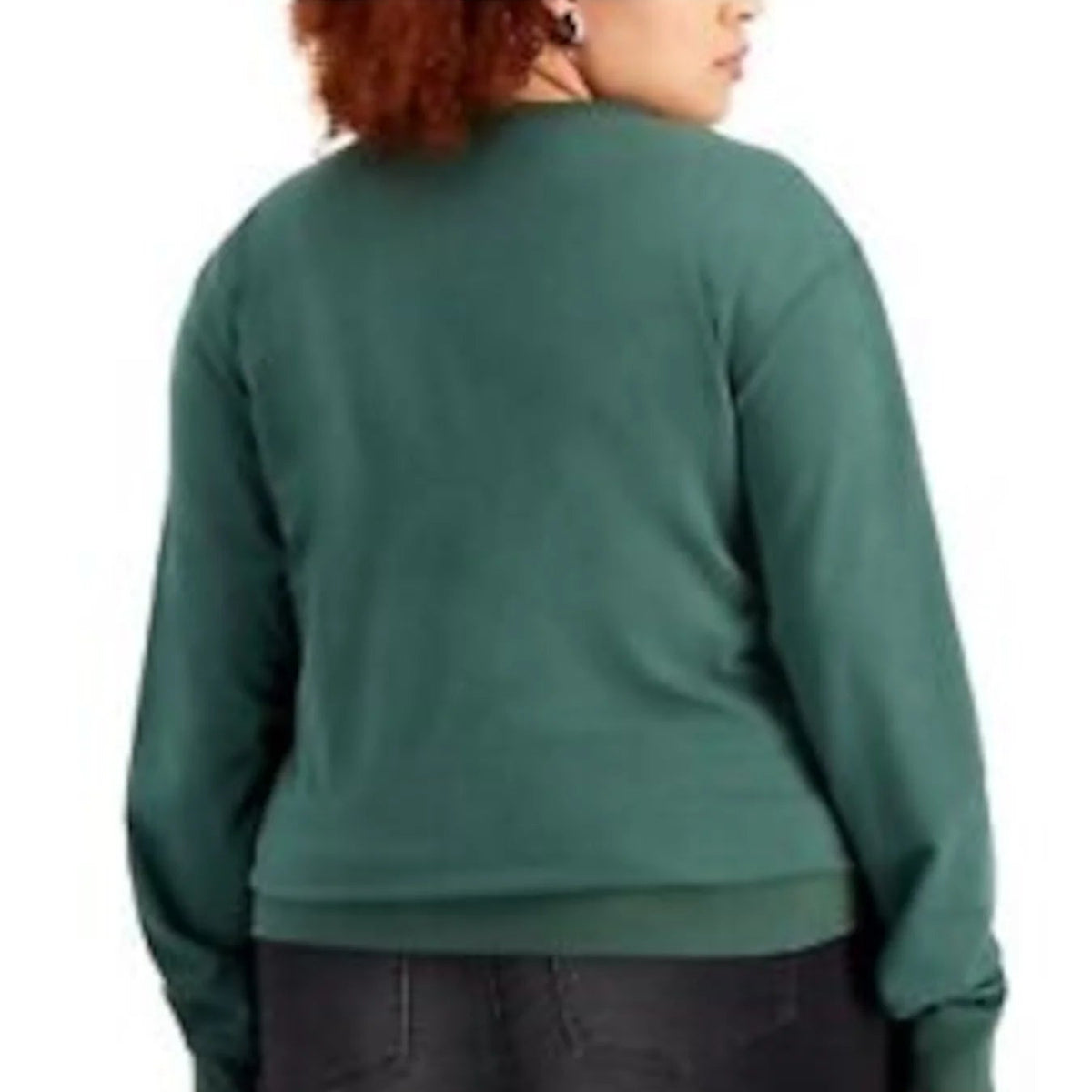 A woman shown from the back wearing a dark green long-sleeve crewneck sweatshirt and black jeans against a plain white background.