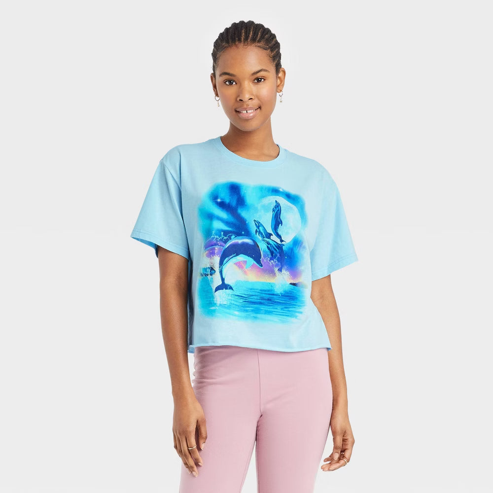 Women's Mighty Fine Dolphins graphic short sleeve cropped t-shirt featuring a vibrant dolphin design on a casual shirt.
