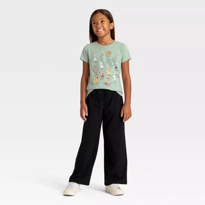 Girls' Disney Nice List Dogs and Cats holiday graphic T-shirt by Mad Engine in green, featuring festive dog and cat illustrations.