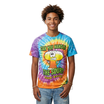 Person wearing a colorful tie-dye t-shirt with text and graphics on a plain background