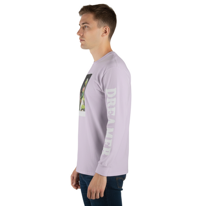 Man wearing a light purple long-sleeve shirt with a graphic design on a plain background