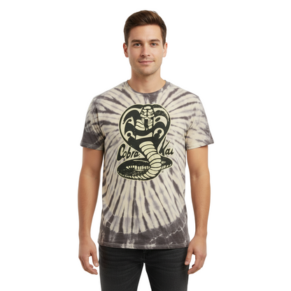 Man wearing a tie-dye t-shirt with a cobra logo on a white background
