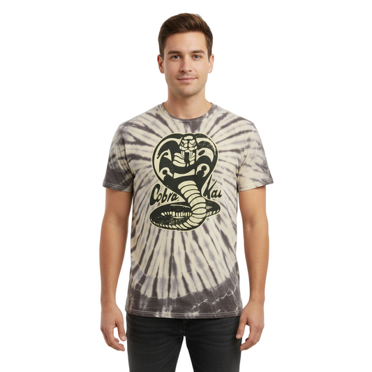 Man wearing a tie-dye t-shirt with a cobra logo on a white background