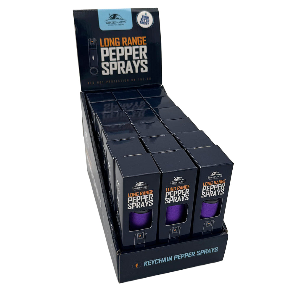 Display of long-range pepper sprays in packaging on a white background