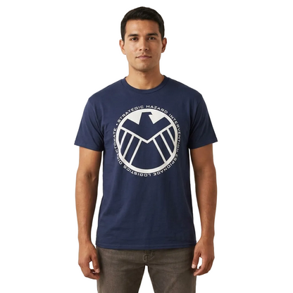 A man wearing a navy blue crewneck t-shirt with a white circular graphic of the S.H. 