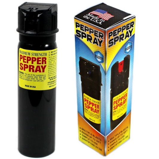 Black pepper spray bottle with yellow label and packaging displaying 'Made in the USA' on a white background.