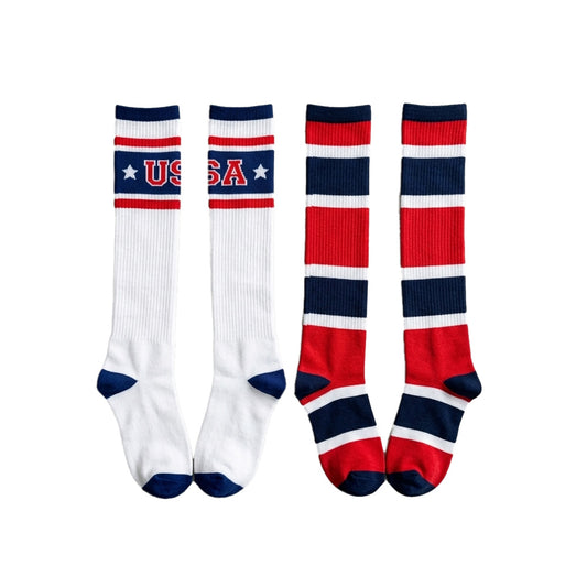 Pair of women's Bioworld USA knee-high socks with red, white, and blue stripes, size 4-10, featuring patriotic USA flag design.