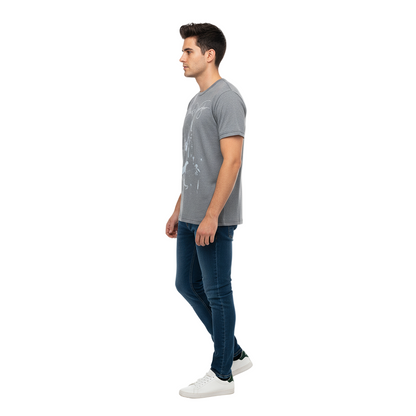 Man wearing a gray t-shirt and blue jeans on a white background