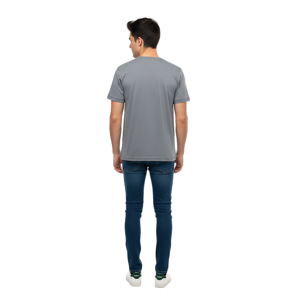 Man wearing a gray t-shirt and blue jeans on a white background