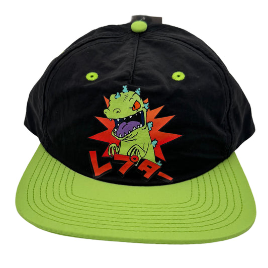 Black cap with green brim and alien graphic on a white background