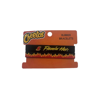 Two Cheetos-branded black rubber bracelets with red and yellow flame graphics and yellow script lettering, displayed on an orange retail card against a plain light background.
