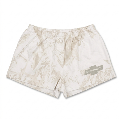 Women junior's white cloud wash Chevrolet logo sleep shorts with an elastic waistband and soft fabric for comfortable loungewear.