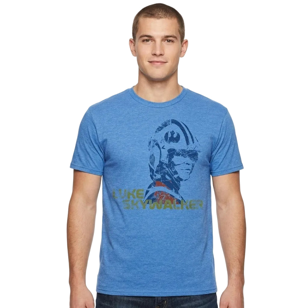 A man wearing a heather blue crewneck t-shirt with a distressed graphic of Luke Skywalker and the text 'LUKE SKYWALKER' on the front, set against a plain white background.