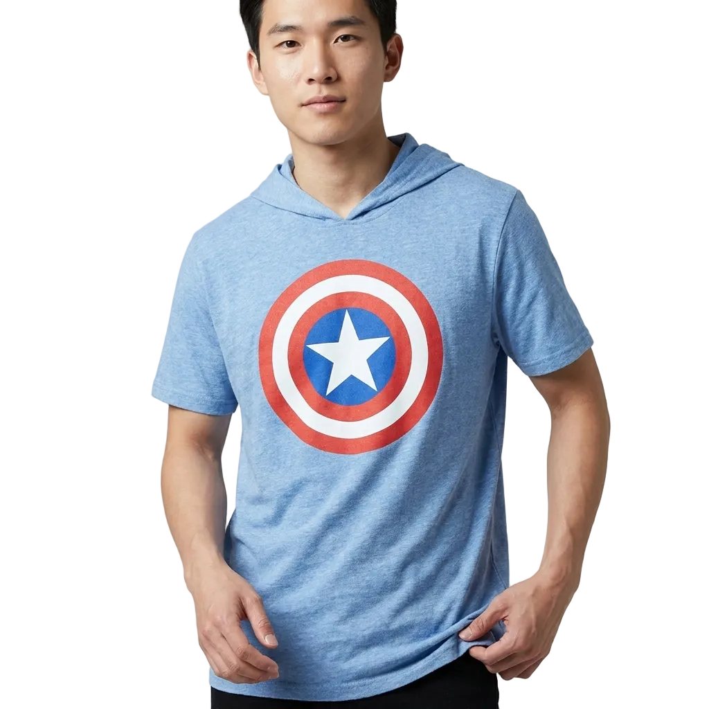 A man wearing a heather blue hooded t-shirt with a Captain America shield graphic on the chest, photographed against a neutral gray studio background.