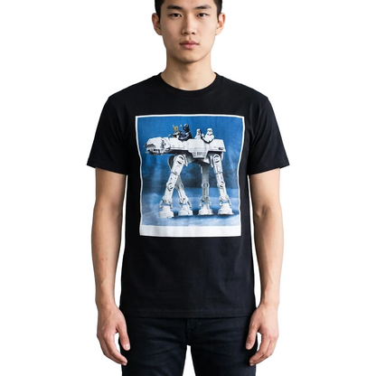 A man wearing a black crewneck t-shirt with a large graphic print of an AT-AT walker on the front, set against a minimalist white background.