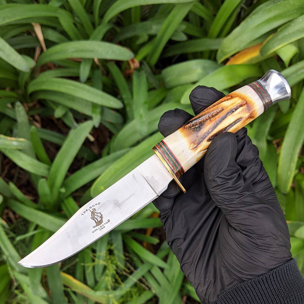 Bone Collector BC 815 two-piece hunting knife set with 8.5-inch and 4.5-inch blades and leather sheath, designed for outdoor hunting.