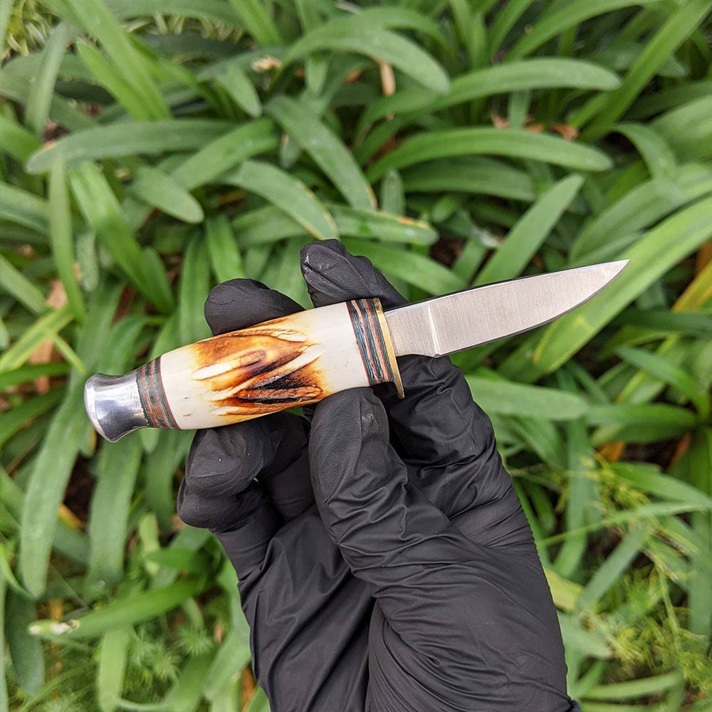 Bone Collector BC 815 hunting knife set with 8.5-inch and 4.5-inch blades in leather sheath, two-piece design for outdoor use.