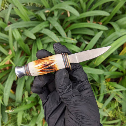 Bone Collector BC 815 hunting knife set with 8.5-inch and 4.5-inch blades in leather sheath, two-piece design for outdoor use.