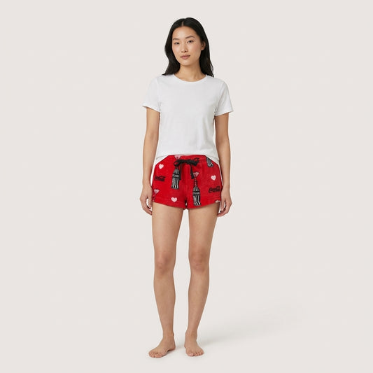 Red Coca-Cola Love fleece shorts for women by Bioworld, featuring a cozy sleepwear design with Coca-Cola branding.