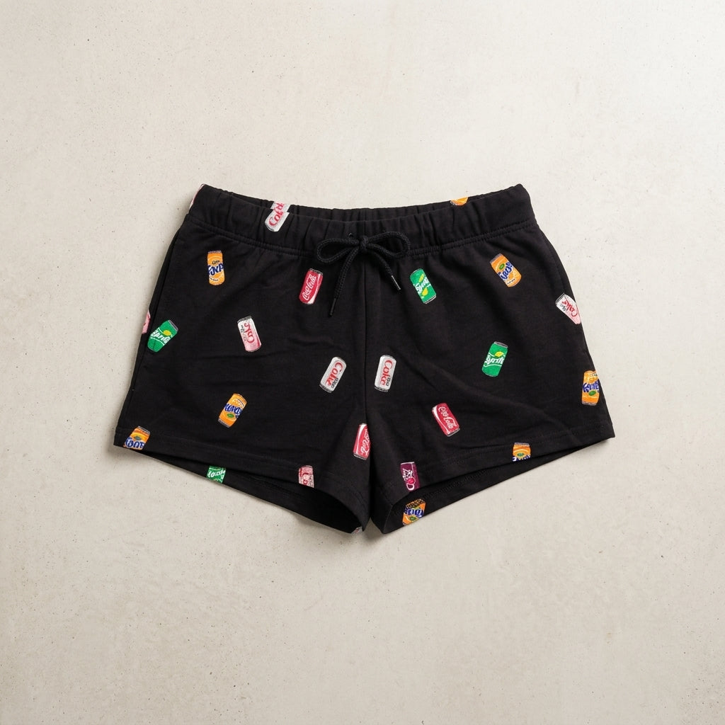 Women's black Coca-Cola soda cans shorts sleepwear by Bioworld, featuring a fun print of soda cans on comfortable sleep shorts.