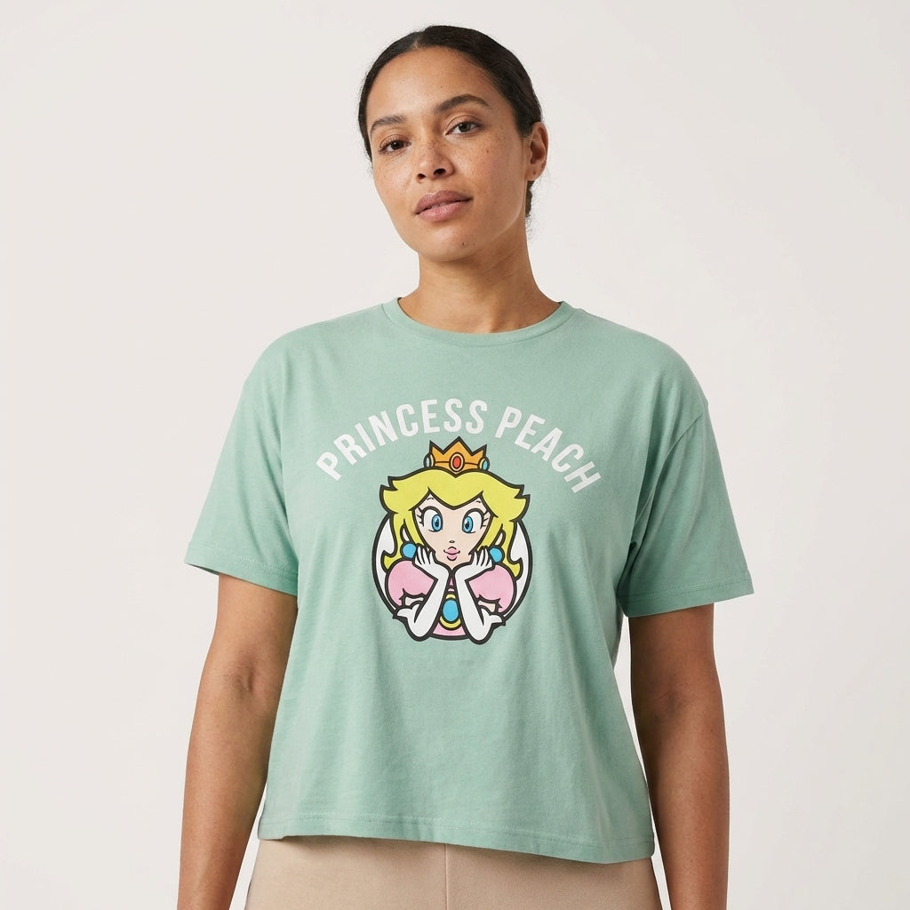 Light green Princess Peach Super Mario graphic T-shirt for women by Mad Engine, featuring a colorful Mario character design.