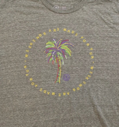 Gray t-shirt with a palm tree and text design on a plain background