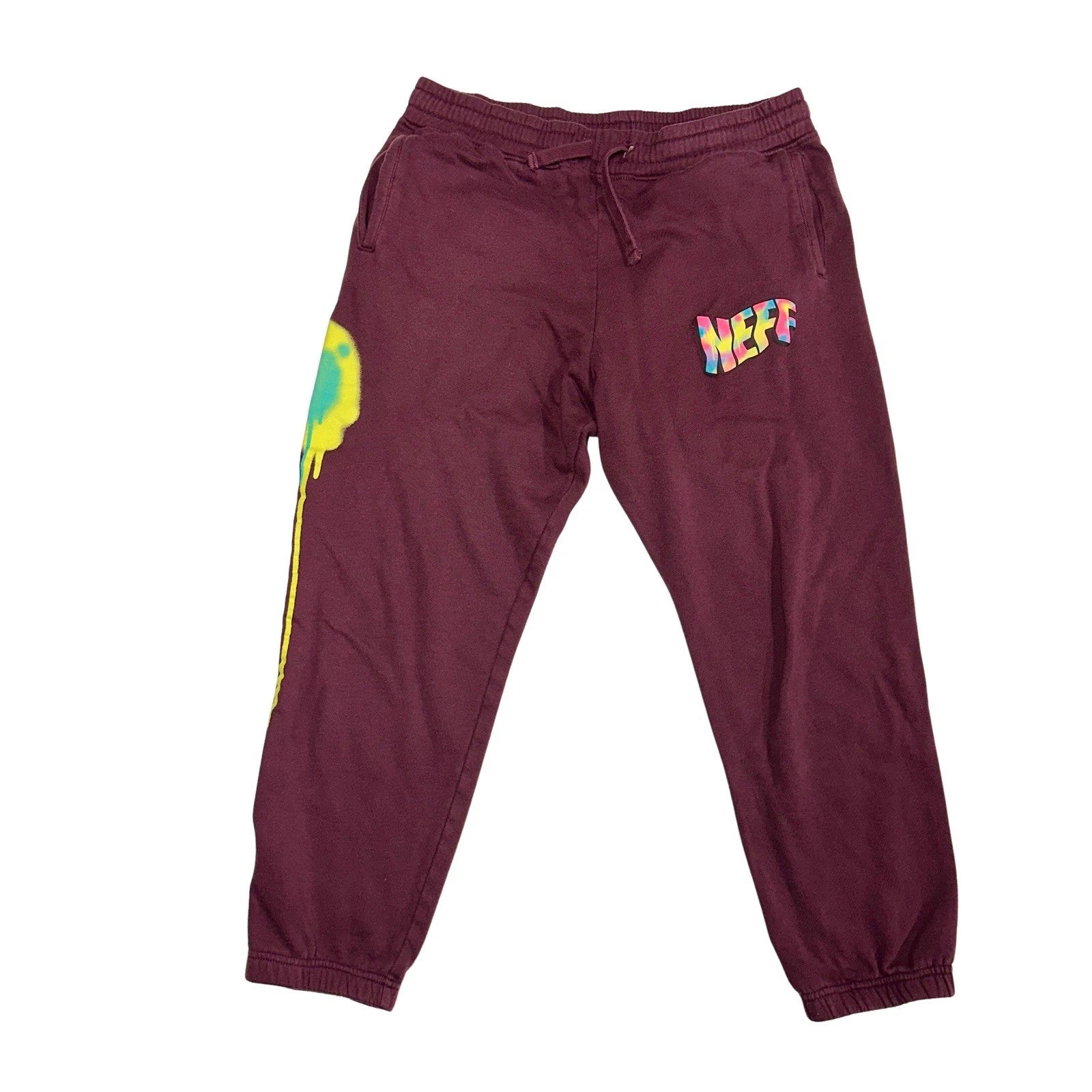 Maroon sweatpants with colorful 'NEFF' logo on a white background