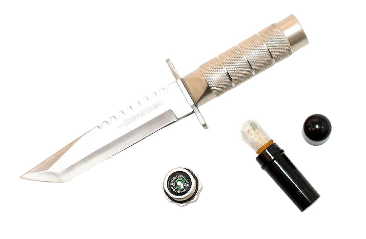 A fixed-blade knife with a textured silver handle and a partially serrated silver blade, shown on a white background alongside a small black cylindrical case, a black spherical object, and a round compass.