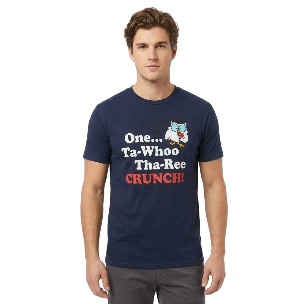 A man wearing a navy blue graphic t-shirt with a cartoon owl and the text 'One.
